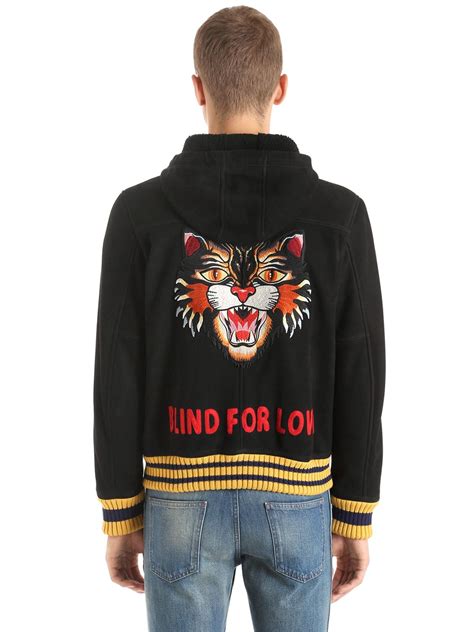 Bomber in cat embroidered shearling 